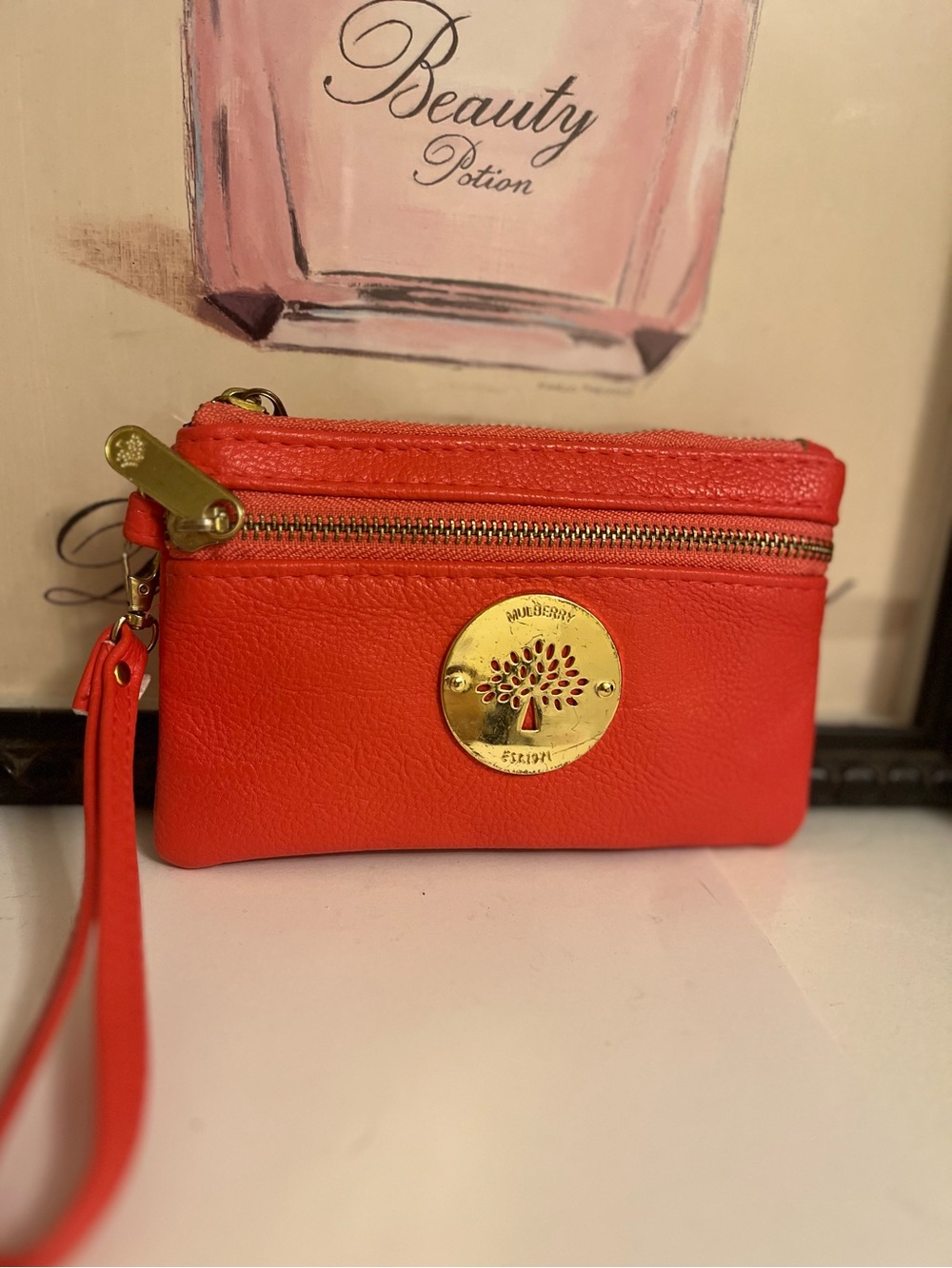 Mulberry Coral Leather Zip Pouch Wristlet with Gold Medallion